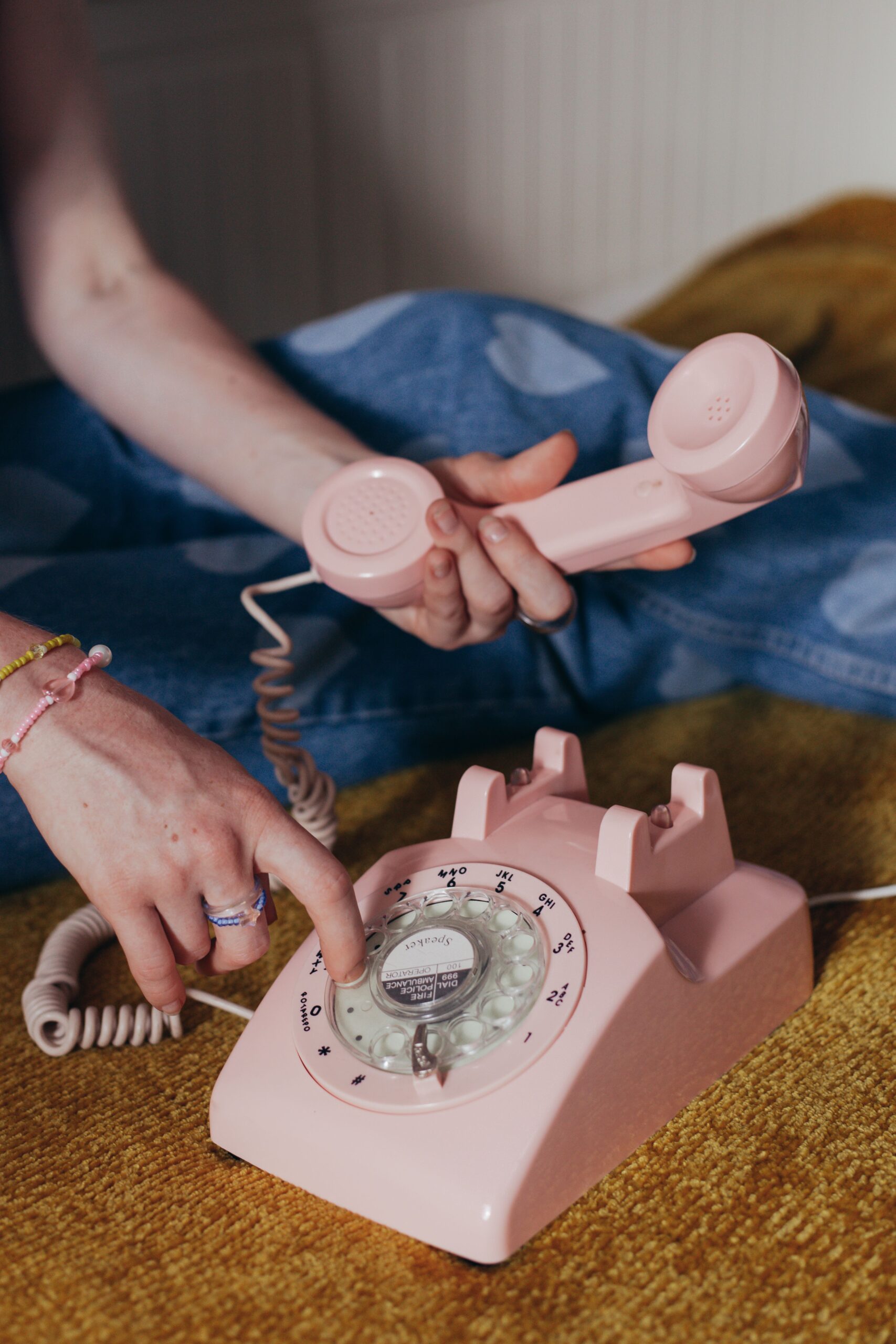 Hand using a vintage telephone